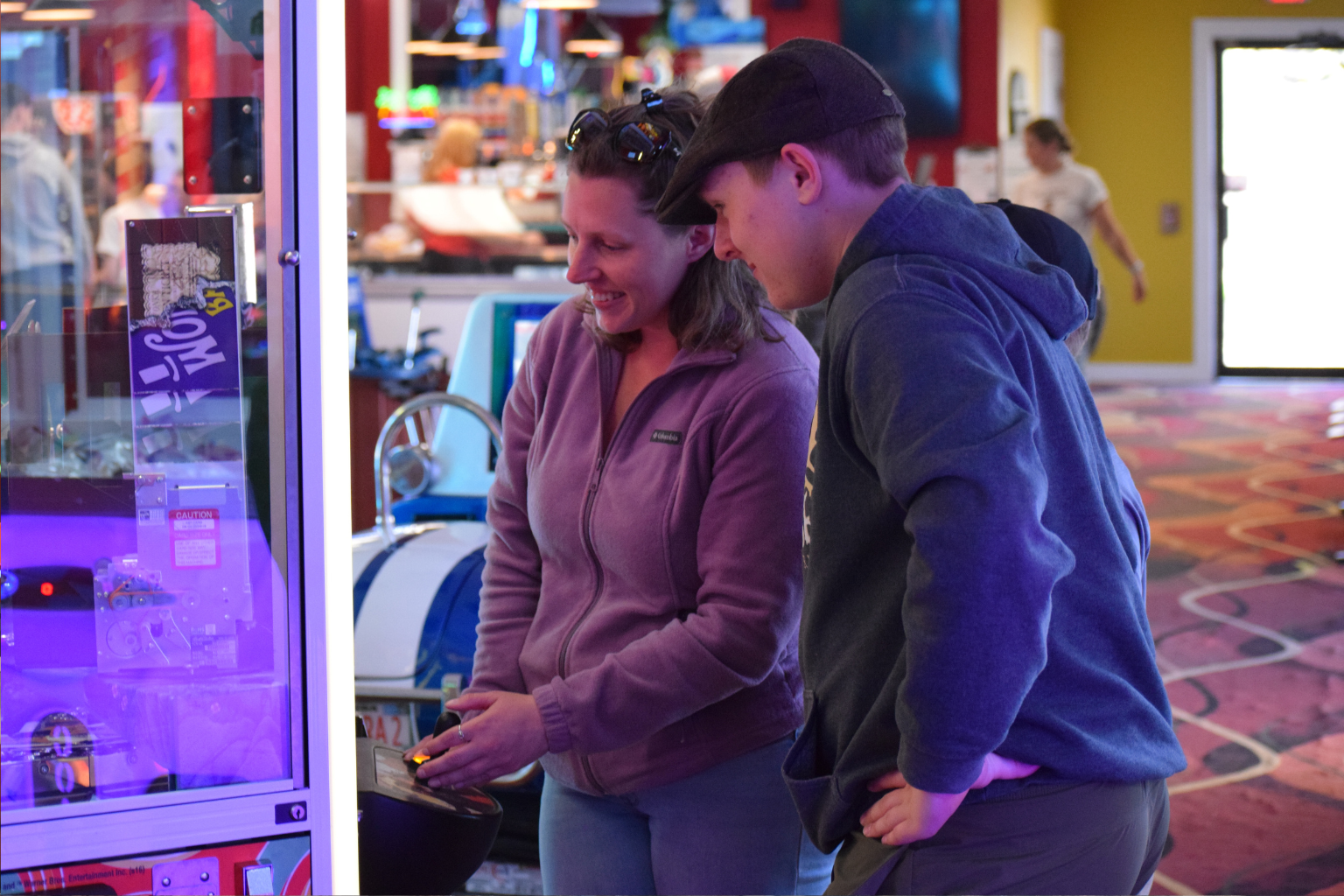 mother and song playing arcade game