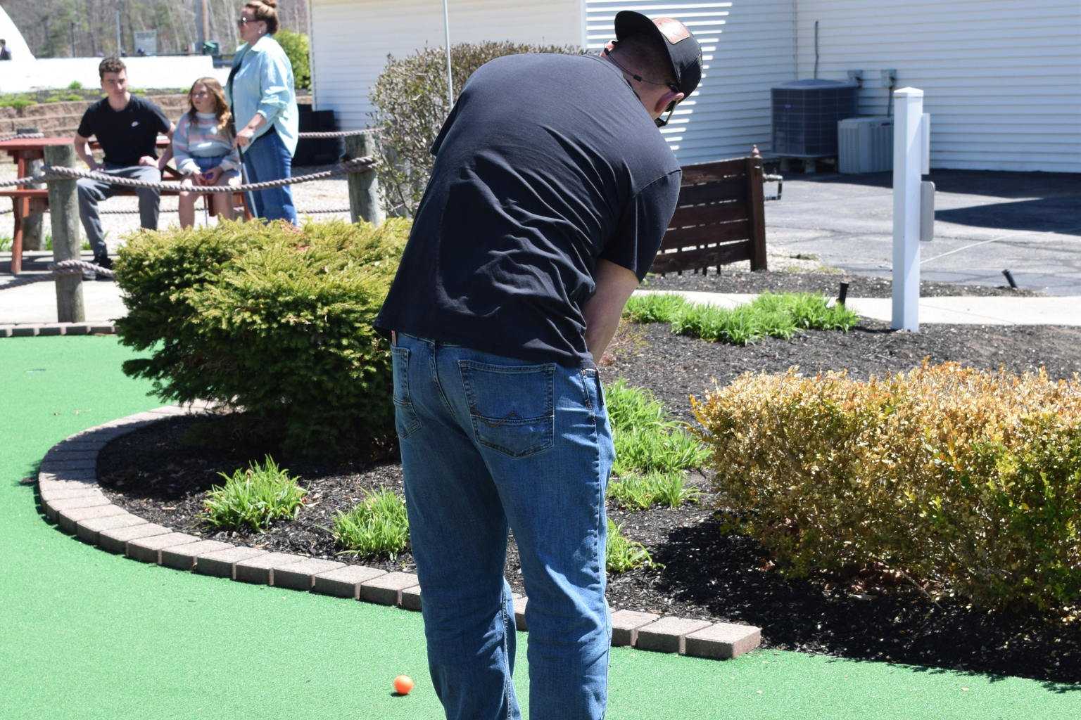 teeing off mini golf